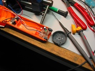 Battery pack can be charged externally via wall-wart or can supply power to cell phones or other accessories via battery pack or Dynamo. Handy little setup if the lights go out.